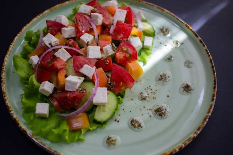 A Greek salad with feta, olives, cucumber and tomato